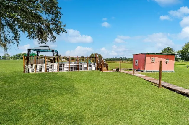 a view of a backyard with a small cabin