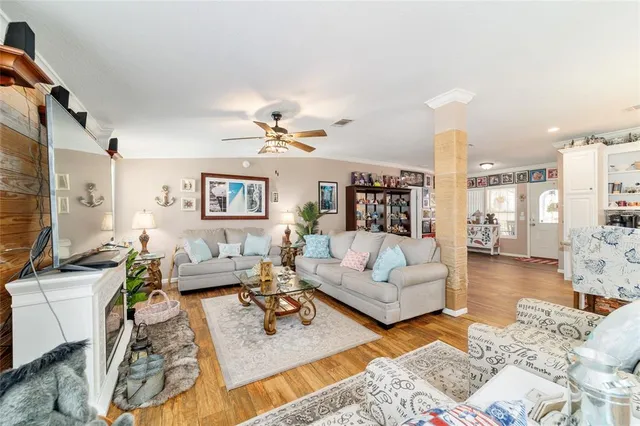 a living room with fireplace furniture and a fireplace