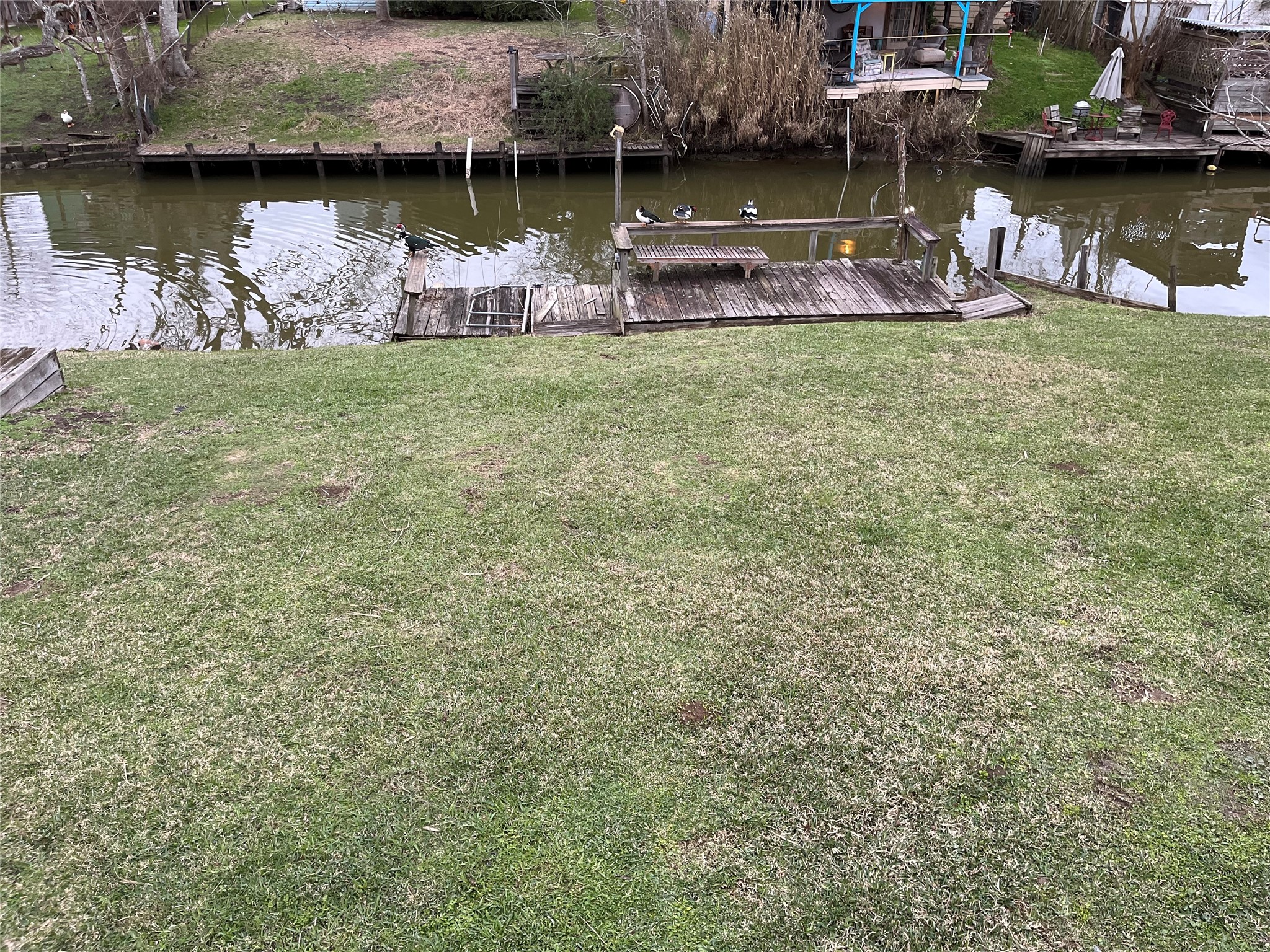 12022 Annette Road, Unit CR657 Angleton, TX 77515 - Photo 3 of 26 a view of a lake with boats and trees