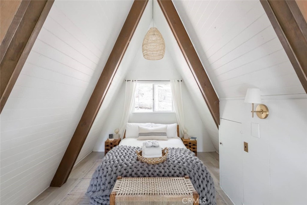 911 Kuffel Canyon Road Lake Arrowhead, CA 92385 - Photo 12 of 23 a front view of a house with wooden floor