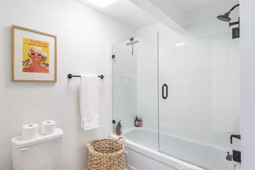 911 Kuffel Canyon Road Lake Arrowhead, CA 92385 - Photo 15 of 23 a bathroom with a bathtub and a shower