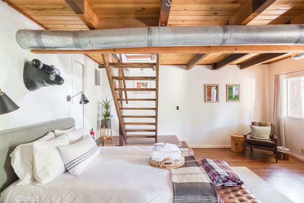 911 Kuffel Canyon Road Lake Arrowhead, CA 92385 - Photo 21 of 23 a bedroom with a bed and a window