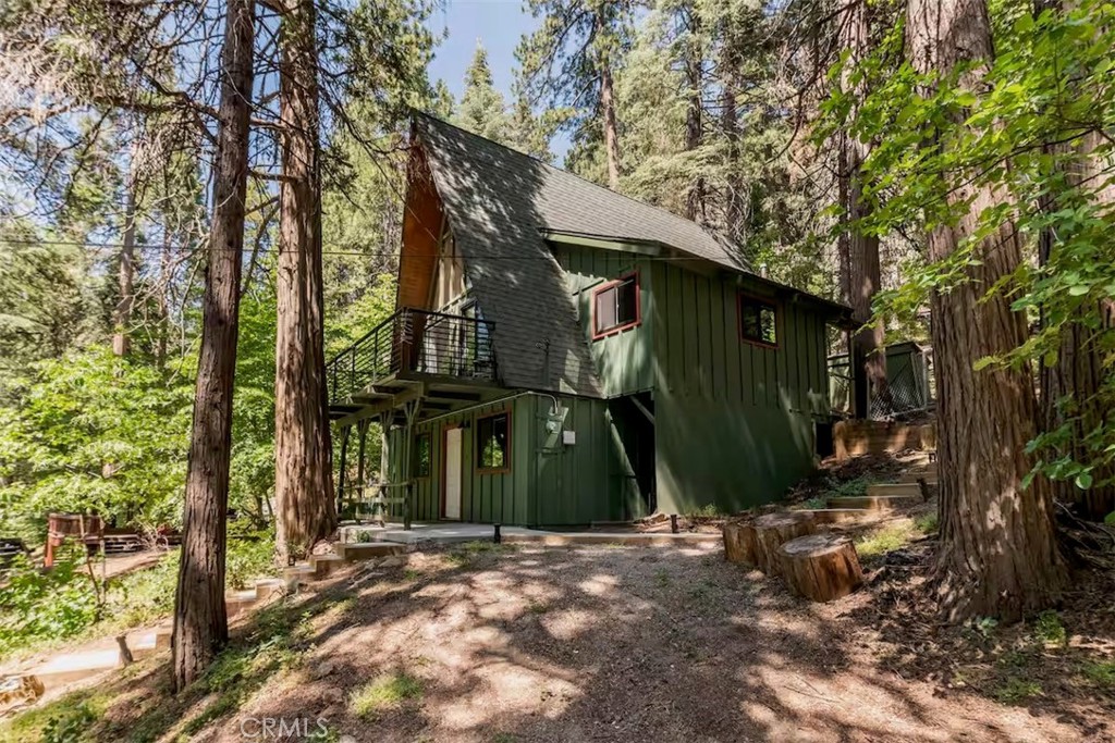 911 Kuffel Canyon Road Lake Arrowhead, CA 92385 - Photo 22 of 23 a view of a house with a tree