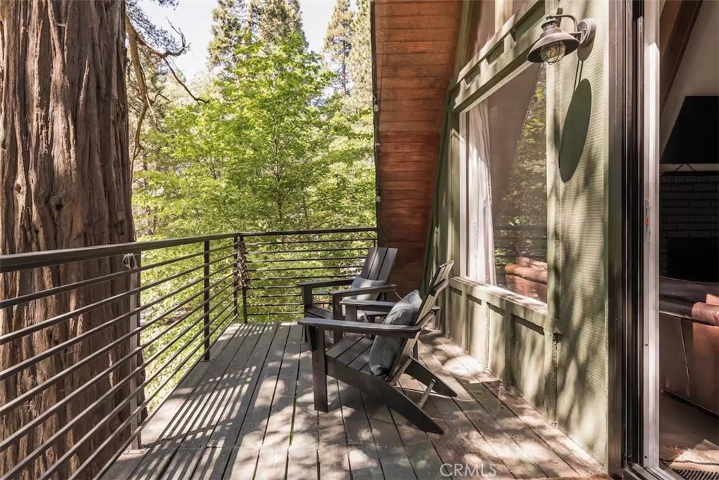 911 Kuffel Canyon Road Lake Arrowhead, CA 92385 - Photo 9 of 23 a view of a balcony with chairs