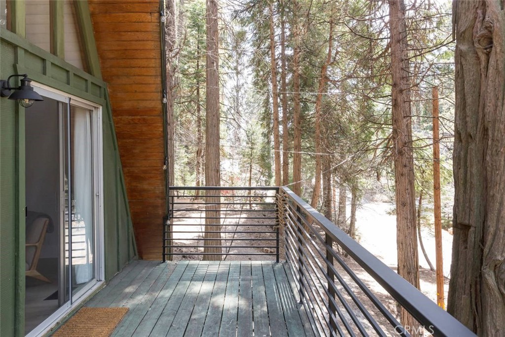 911 Kuffel Canyon Road Lake Arrowhead, CA 92385 - Photo 10 of 23 a view of balcony with wooden floor