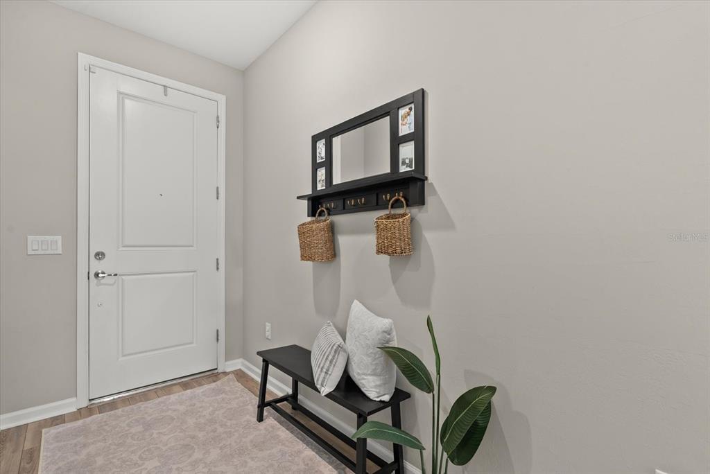 3310 Chestertown Loop Bradenton, FL 34211 - Photo 23 of 71 a room with a table and a chair