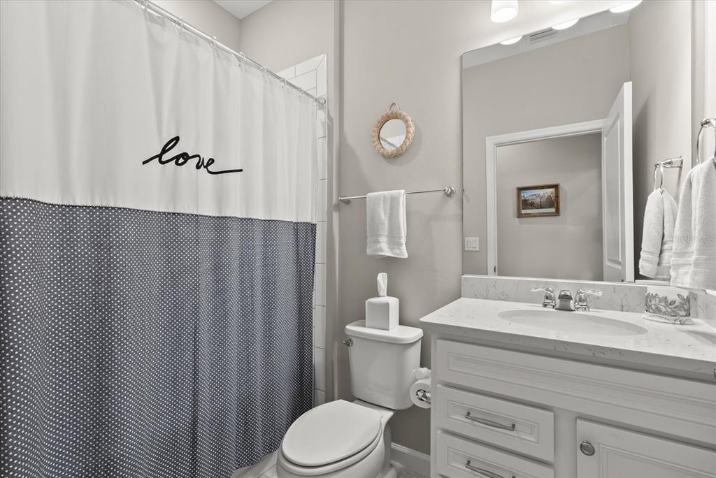 3310 Chestertown Loop Bradenton, FL 34211 - Photo 25 of 71 a bathroom with a sink a toilet and shower