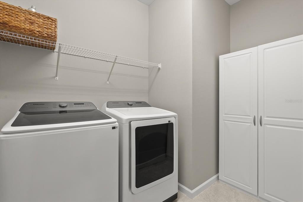 3310 Chestertown Loop Bradenton, FL 34211 - Photo 27 of 71 a utility room with dryer and washer