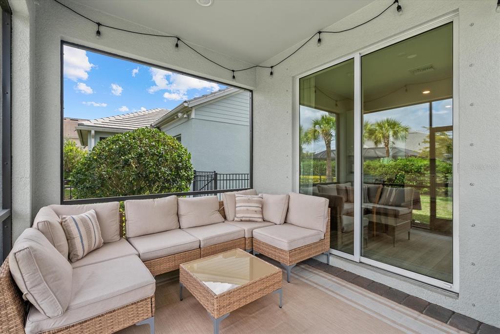 3310 Chestertown Loop Bradenton, FL 34211 - Photo 29 of 71 a living room with furniture and a large window