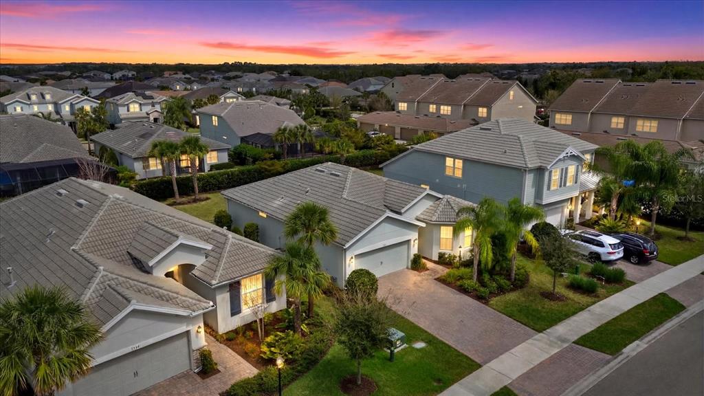 3310 Chestertown Loop Bradenton, FL 34211 - Photo 34 of 71 an aerial view of multiple houses with a yard