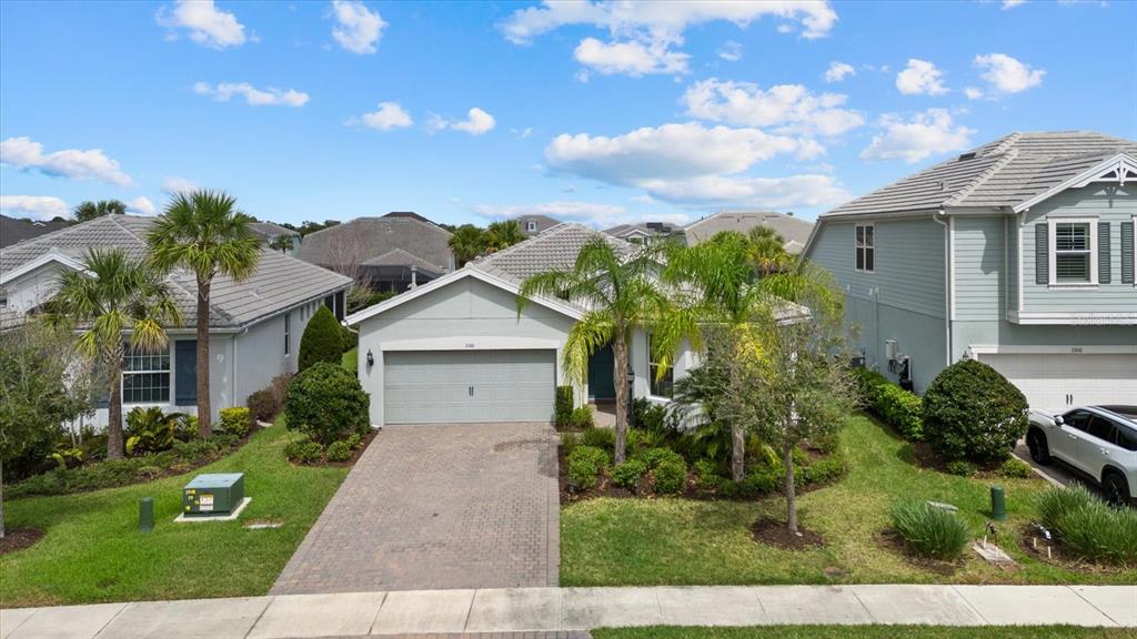 3310 Chestertown Loop Bradenton, FL 34211 - Photo 40 of 71 a front view of a house with a garden