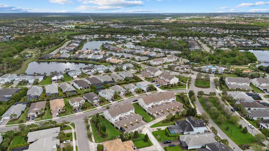3310 Chestertown Loop Bradenton, FL 34211 - Photo 44 of 71 an aerial view of a city with lots of residential buildings
