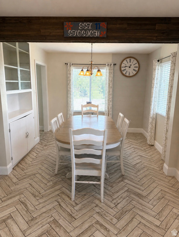 287 100 North Orem, UT 84057 - Photo 4 of 18 Dining area with hanging lights and parquet flooring