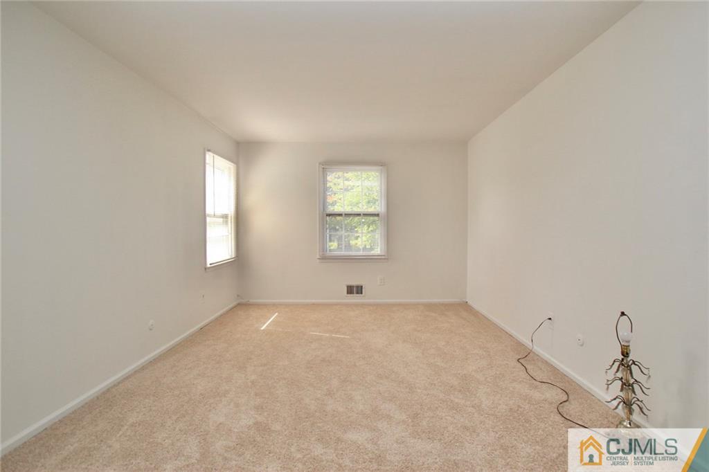 50 Roxy Avenue Edison, NJ 08820 - Photo 14 of 25 an empty room with windows