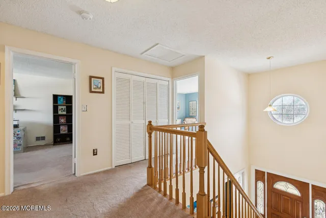a view of a hallway with closet area