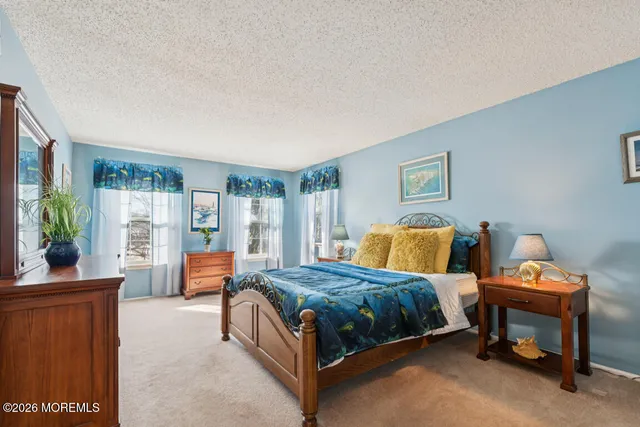 a bedroom with 2 bed and a couch