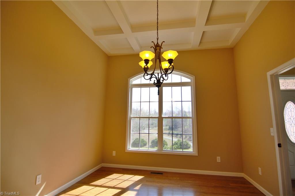 293 Winding Ridge Lane Lexington, NC 27292 - Photo 15 of 27 Dining room off kitchen with coffered ceiling and Bamboo floors