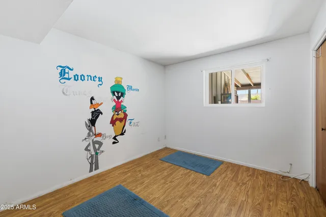 a view of a storage & utility room with refrigerator