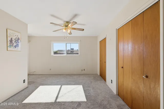 a view of a house with pool and chairs