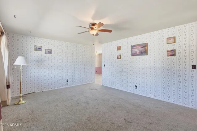 a kitchen with granite countertop a stove a sink and a refrigerator