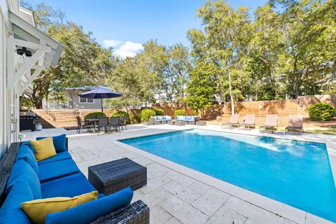 a spacious bedroom with a bed and a flat screen tv