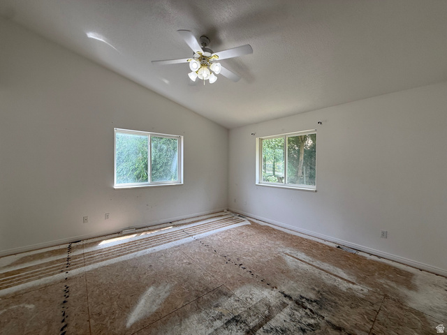 838 East Mountain Road Logan, UT 84321 - Photo 15 of 37 Room with vaulted ceiling, two windows, and exposed subflooring