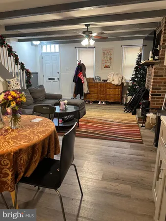 a bedroom with bed and a chandelier