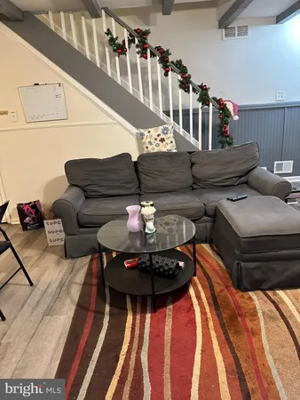 a living room with furniture and a table
