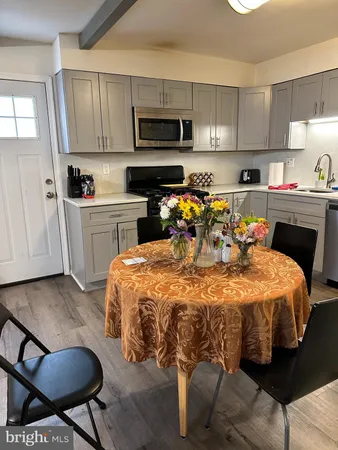 a bed room with a bed and a television