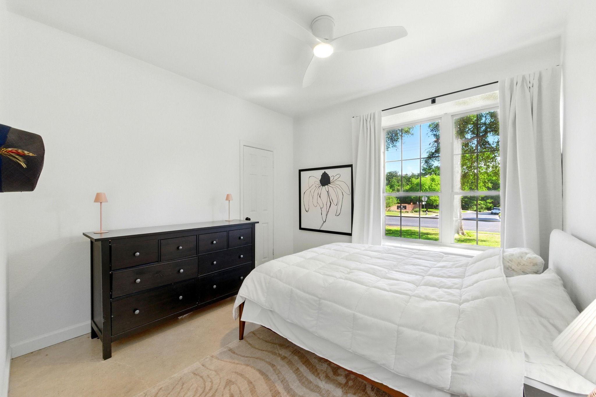 5807 Convict Hill Road Austin, TX 78749 - Photo 21 of 27 This versatile room with bright natural light makes an ideal home office, reading nook, or third bedroom. Neutral tones and a ceiling fan add comfort and flexibility.