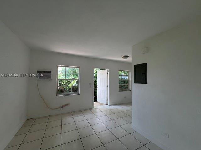 441 Southwest 10th Street, Unit 4 Miami, FL 33130 - Photo 6 of 18 a view of an empty room with window and chandelier