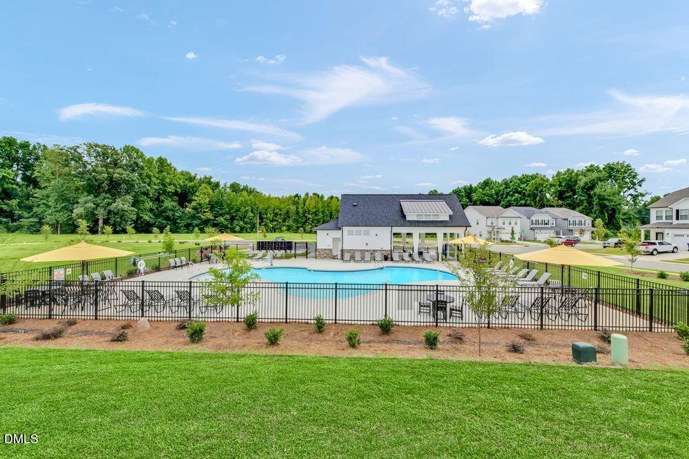 55 Shay Street Angier, NC 27501 - Photo 12 of 54 a view of an ocean with a big yard and large trees