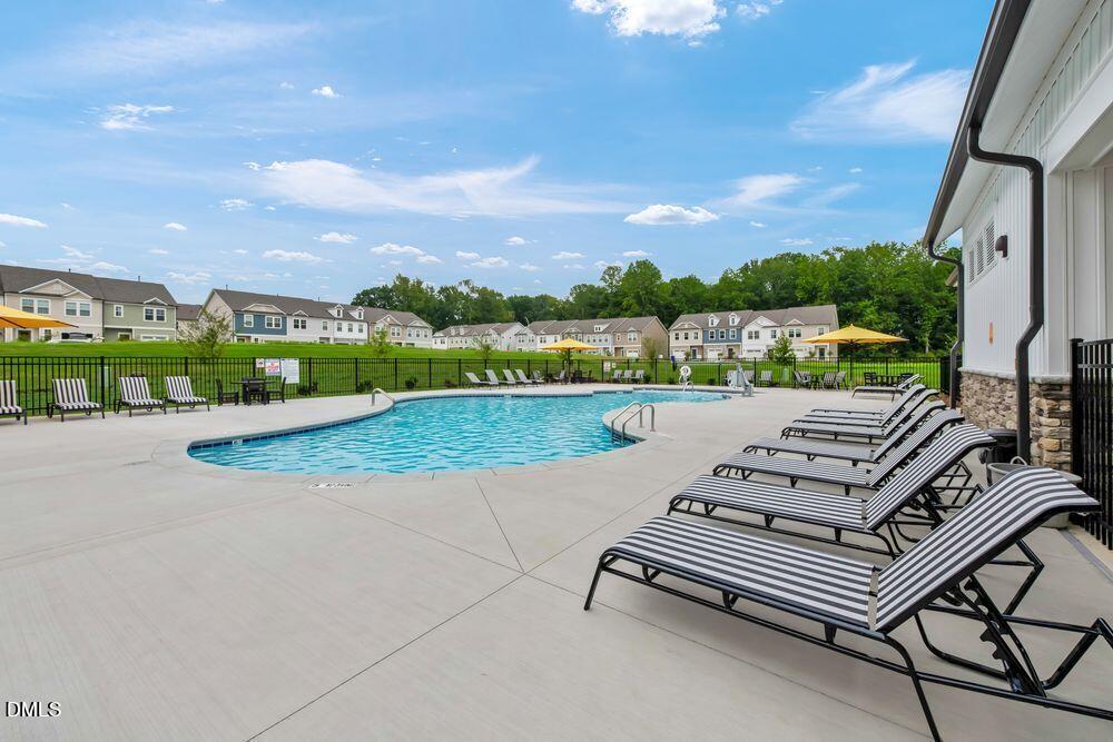 55 Shay Street Angier, NC 27501 - Photo 16 of 54 an outdoor view of a garden with lawn chairs