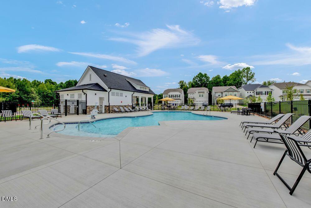 55 Shay Street Angier, NC 27501 - Photo 20 of 54 a view of house and outdoor space with seating area