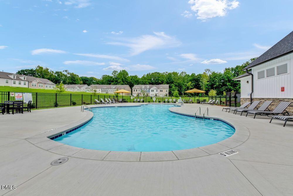 55 Shay Street Angier, NC 27501 - Photo 24 of 54 a view of a swimming pool and a terrace