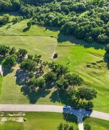 a view of a lake with a yard