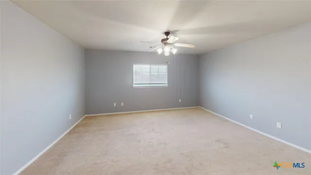 a large spacious bathroom with a large tub and shower