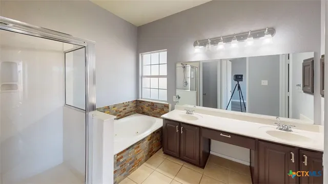 a white toilet sitting next to a bathroom sink
