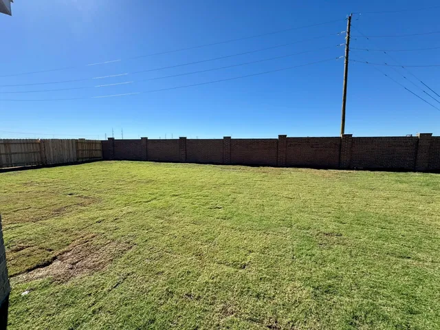 a view of pool with lawn chairs