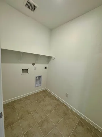 an empty room with white walls