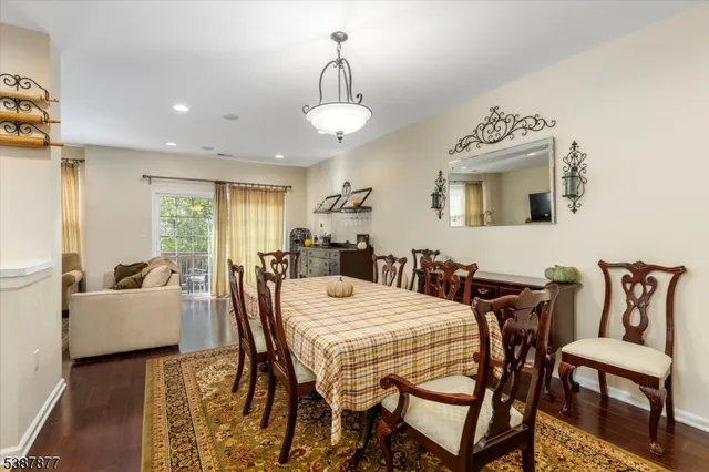 a kitchen with stainless steel appliances granite countertop a refrigerator a sink and a stove