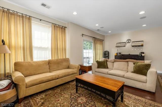 a view of a room with wooden floor and shoes