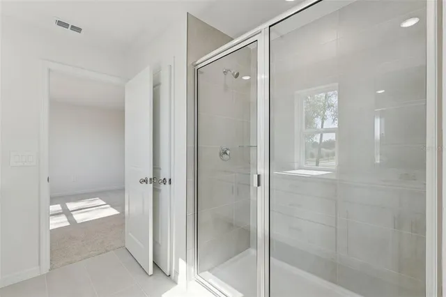 a bathroom with a double vanity sink and mirror