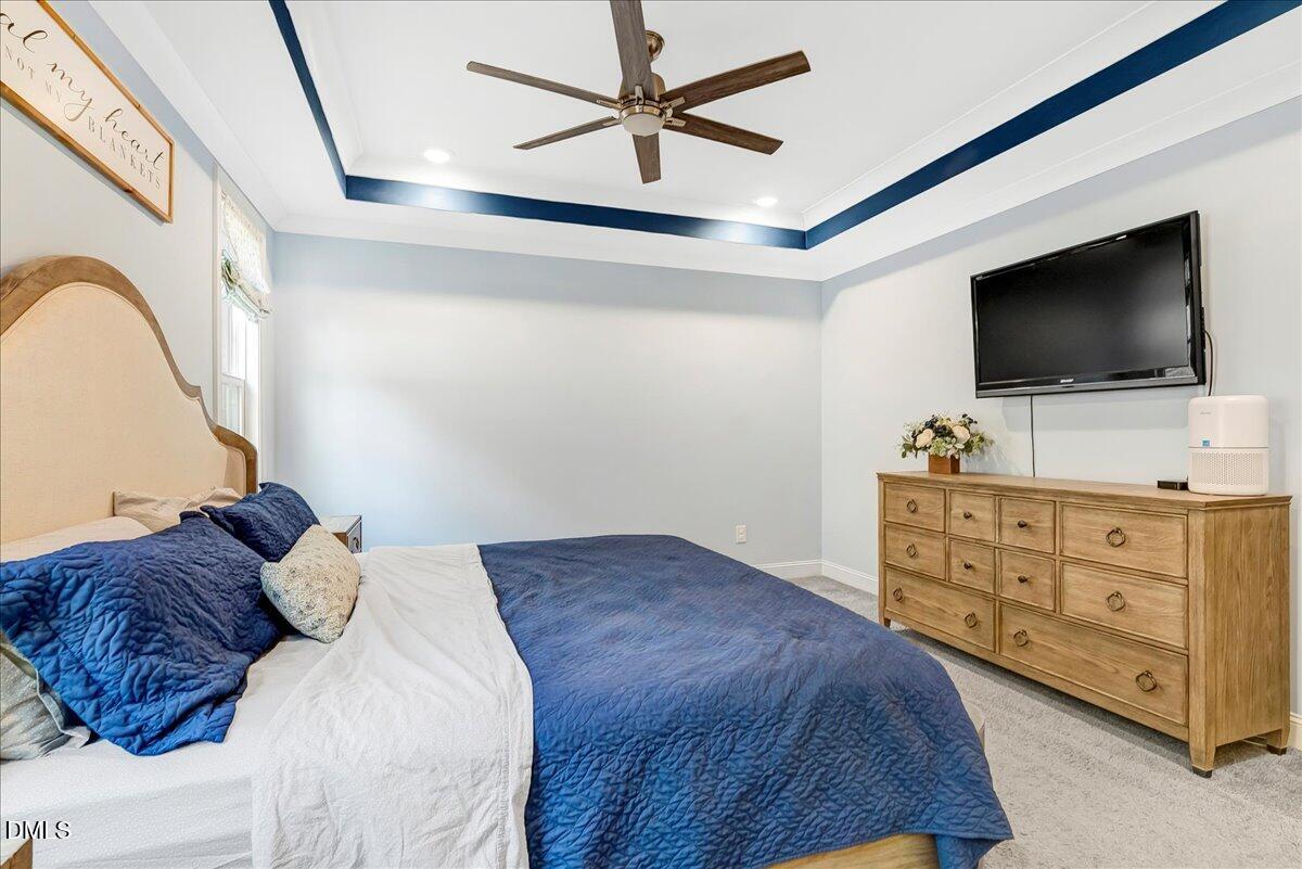 1208 Montgomery Road Franklinton, NC 27525 - Photo 20 of 62 a bedroom with a bed and a flat screen tv