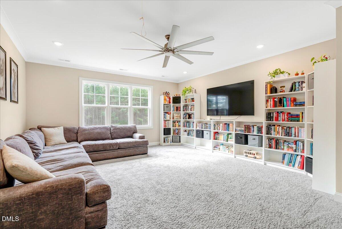 1208 Montgomery Road Franklinton, NC 27525 - Photo 32 of 62 a living room with furniture and a flat screen tv