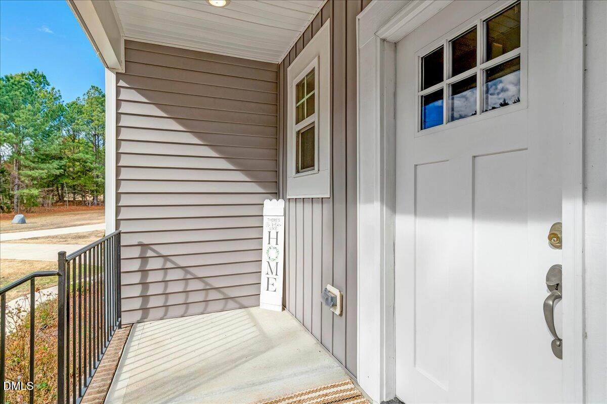 1208 Montgomery Road Franklinton, NC 27525 - Photo 38 of 62 a view of a house with a balcony