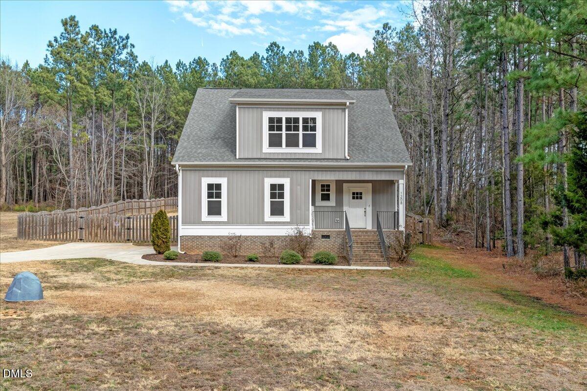 1208 Montgomery Road Franklinton, NC 27525 - Photo 40 of 62 a front view of a house with a yard