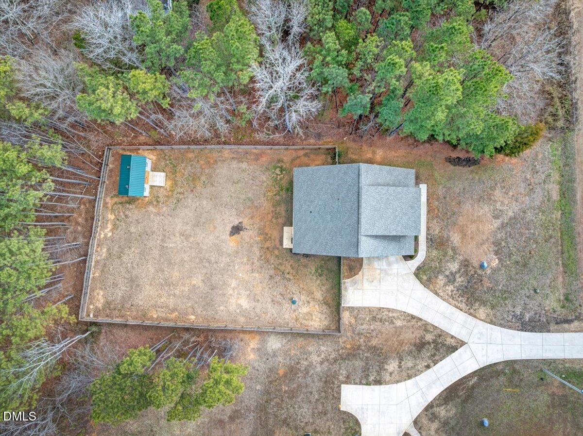 1208 Montgomery Road Franklinton, NC 27525 - Photo 50 of 62 a picture of a tree in front of a house