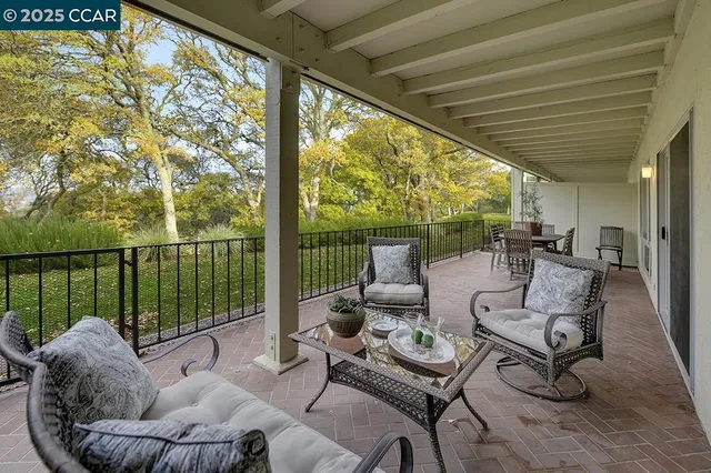 a view of balcony with furniture and outdoor seating