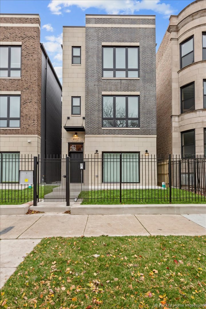 4932 South Champlain Avenue Chicago, IL 60615 - Photo 1 of 27 a view of a brick building next to a yard